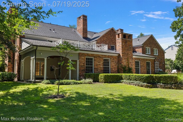 748 Waddington St, Bloomfield Hills, MI 48301 - back of house with french doors, a balcony, a yard, and brick siding
