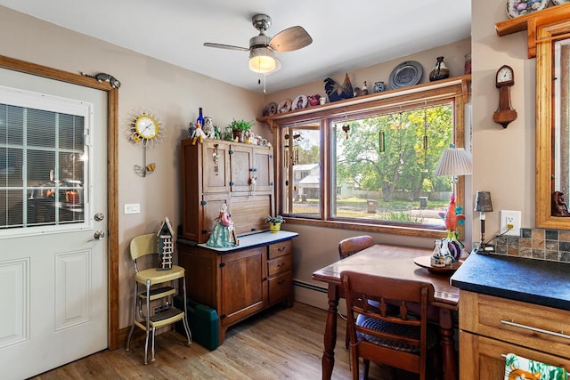 916 Hillcrest Dr, Adrian, MI 49221 - dining room with a ceiling fan and light wood-type flooring