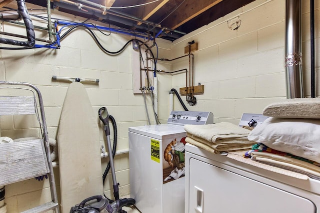 916 Hillcrest Dr, Adrian, MI 49221 - laundry room featuring concrete block wall and washing machine and dryer