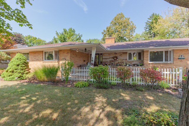 916 Hillcrest Dr, Adrian, MI 49221 - single story home featuring a chimney and brick siding