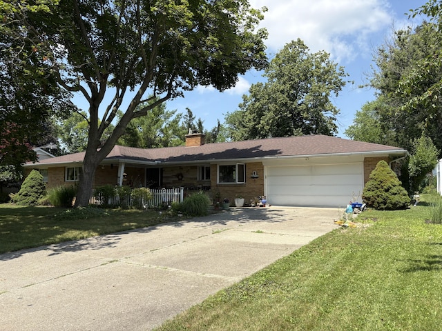 916 Hillcrest Dr, Adrian, MI 49221 - ranch-style house featuring a chimney, a garage, a front lawn, and concrete driveway