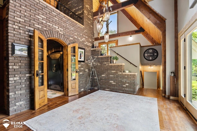 3078 Green Corners Rd, Lapeer, MI 48446 - foyer entrance featuring high vaulted ceiling, hardwood / wood-style flooring, plenty of natural light, beam ceiling, and stairway