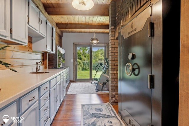 3078 Green Corners Rd, Lapeer, MI 48446 - kitchen featuring a wooden ceiling with exposed beams, wood finished floors, light countertops, and hanging light fixtures