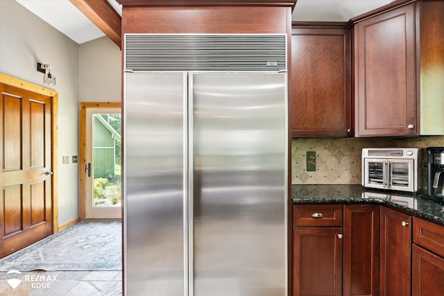 3078 Green Corners Rd, Lapeer, MI 48446 - kitchen with stainless steel built in fridge, backsplash, and dark stone counters