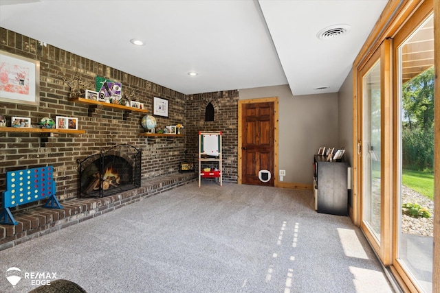 3078 Green Corners Rd, Lapeer, MI 48446 - unfurnished living room featuring carpet flooring, brick wall, a fireplace, and recessed lighting