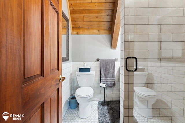 3078 Green Corners Rd, Lapeer, MI 48446 - bathroom with tile walls, tile patterned floors, wainscoting, and a shower with shower door