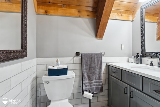 3078 Green Corners Rd, Lapeer, MI 48446 - bathroom with tile walls, vanity, and a wainscoted wall