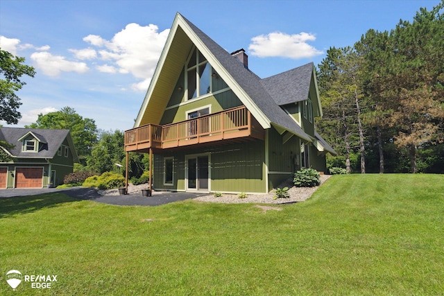 3078 Green Corners Rd, Lapeer, MI 48446 - rear view of house with a chimney, a yard, a deck, and roof with shingles