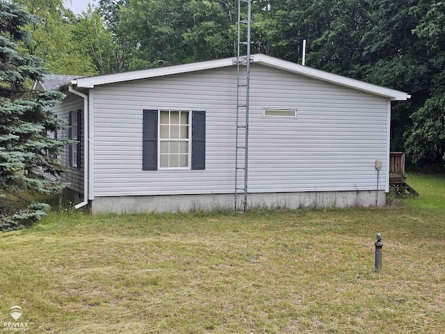 2789 Grass Lake Ave, Clare, MI 48632 - view of property exterior with a yard