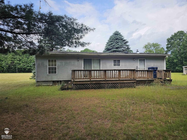 2789 Grass Lake Ave, Clare, MI 48632 - back of property featuring a deck and a yard