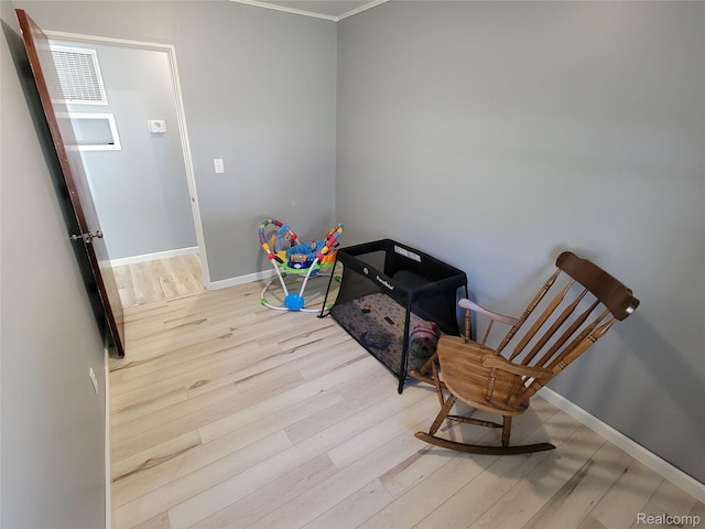 112 Darragh Dr, Battle Creek, MI 49015 - sitting room with wood finished floors and crown molding