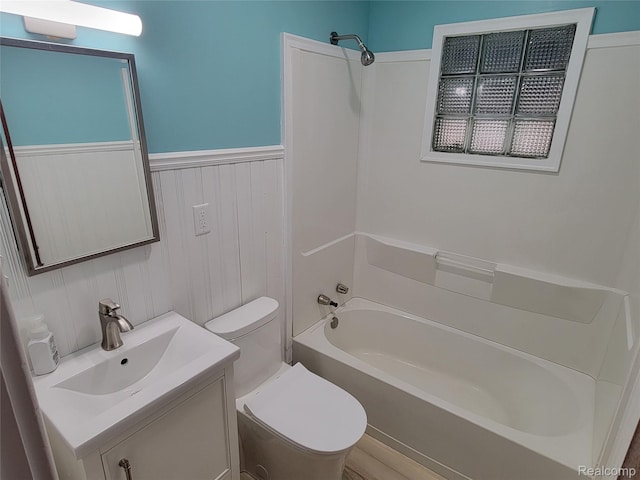 112 Darragh Dr, Battle Creek, MI 49015 - bathroom with vanity, bathing tub / shower combination, and a wainscoted wall