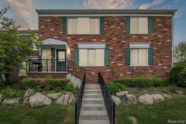 455 Baldwin Ave Unit 203, Rochester, MI 48307 - townhome / multi-family property featuring brick siding and stairs