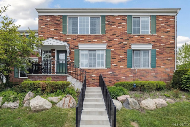 455 Baldwin Ave Unit 203, Rochester, MI 48307 - view of property with brick siding and stairs