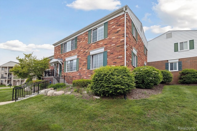 455 Baldwin Ave Unit 203, Rochester, MI 48307 - view of front of home with brick siding and a front yard