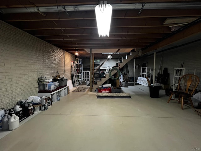 3118 Birch Run, Adrian, MI 49221 - unfinished below grade area with brick wall and stairway