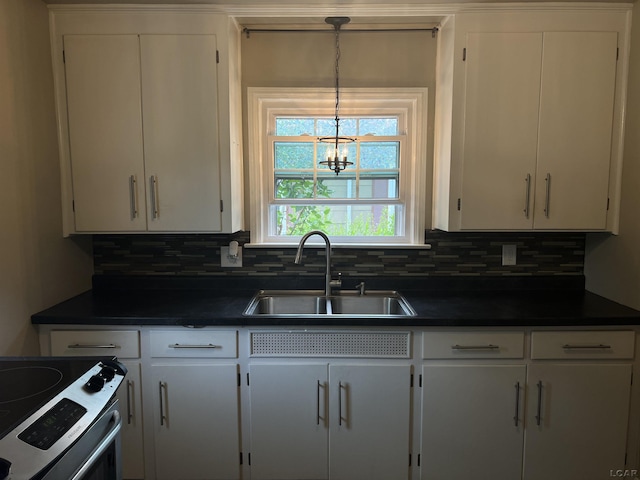 1370 University Ave, Adrian, MI 49221 - kitchen featuring dark countertops, decorative backsplash, and white cabinets