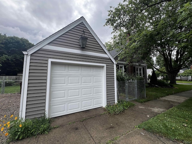 1370 University Ave, Adrian, MI 49221 - garage with concrete driveway