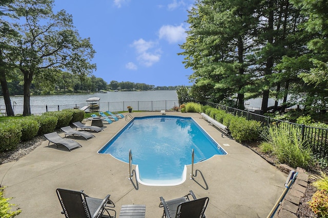 15518 Oak Ridge Dr, Spring Lake, MI 49456 - view of pool featuring a patio area, a fenced backyard, and a water view