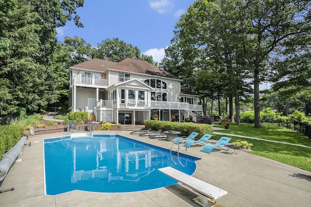 15518 Oak Ridge Dr, Spring Lake, MI 49456 - back of property featuring stairway, a balcony, a patio, and an outdoor pool