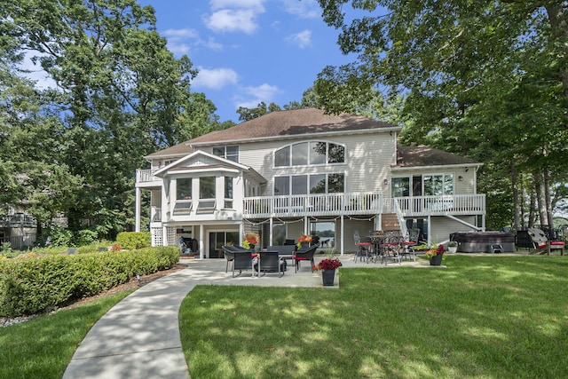 15518 Oak Ridge Dr, Spring Lake, MI 49456 - back of property with a hot tub, a patio area, stairway, a yard, and roof with shingles