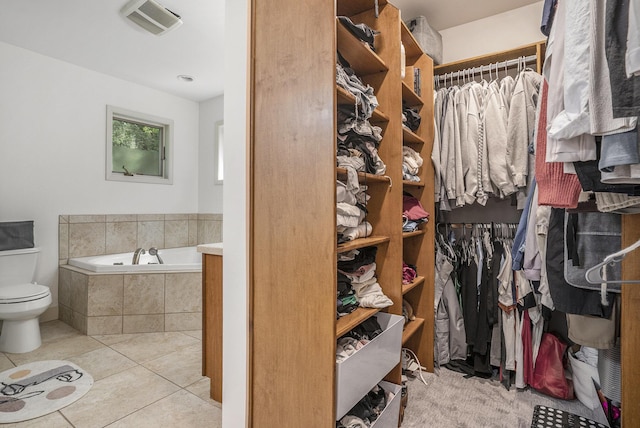 15518 Oak Ridge Dr, Spring Lake, MI 49456 - spacious closet featuring tile patterned floors
