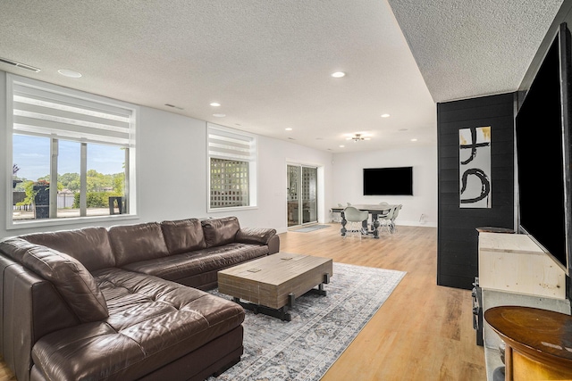 15518 Oak Ridge Dr, Spring Lake, MI 49456 - living room featuring light wood-type flooring, a textured ceiling, and recessed lighting