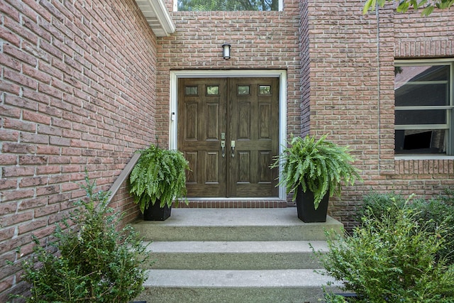 15518 Oak Ridge Dr, Spring Lake, MI 49456 - doorway to property featuring brick siding