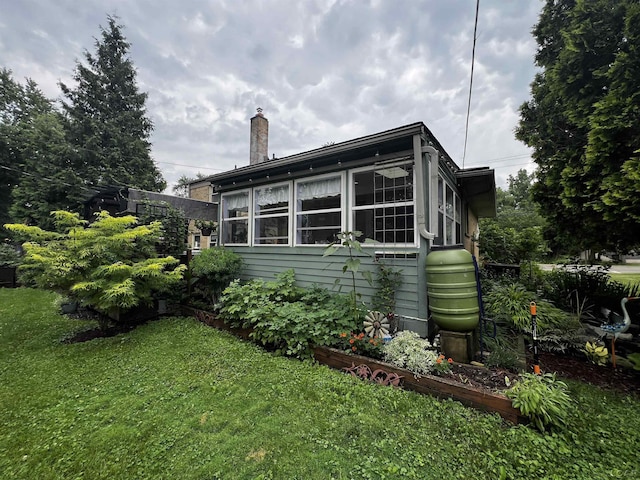231 Willis Rd, Saline, MI 48176 - view of side of home with a yard and a chimney