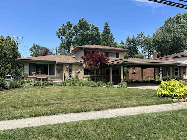 231 Willis Rd, Saline, MI 48176 - view of front of property featuring a chimney, an attached carport, a front yard, and brick siding