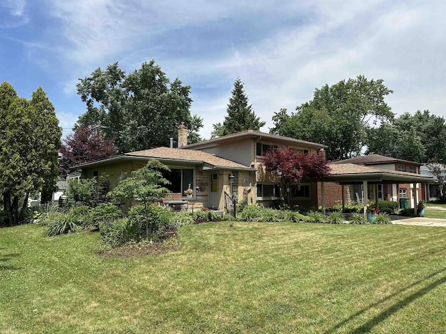 231 Willis Rd, Saline, MI 48176 - view of front of property with a front lawn, a chimney, and driveway