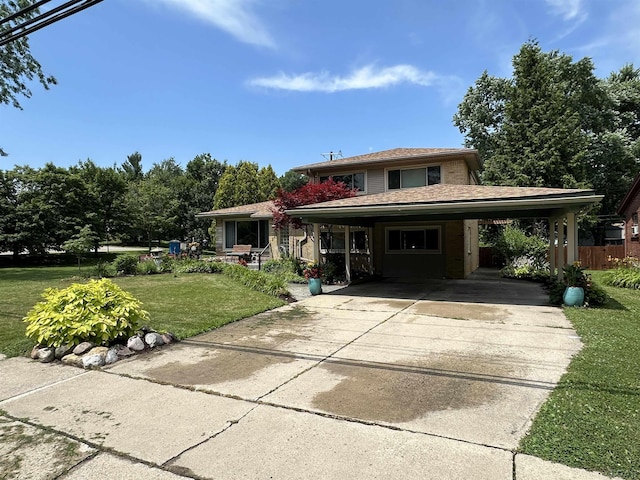 231 Willis Rd, Saline, MI 48176 - view of front of property with a carport and concrete driveway