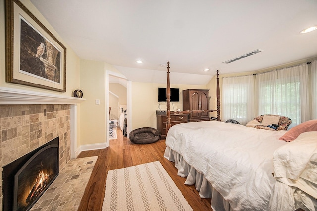 14300 Ridgemont St, Gregory, MI 48137 - bedroom with a fireplace, wood finished floors, and recessed lighting
