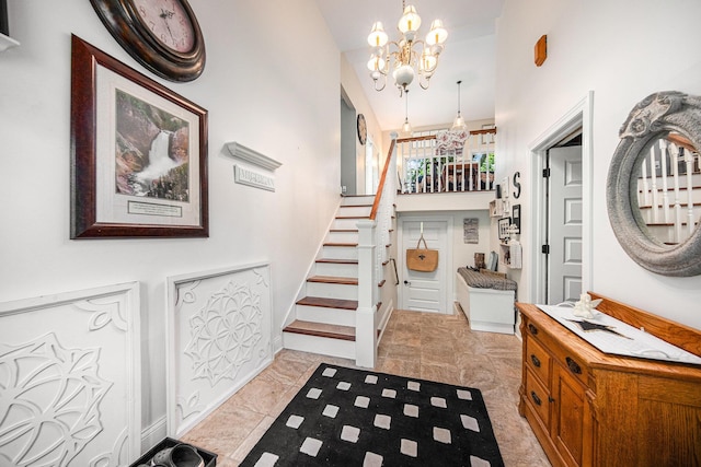 14300 Ridgemont St, Gregory, MI 48137 - foyer with a chandelier, stairs, and light marble finish flooring
