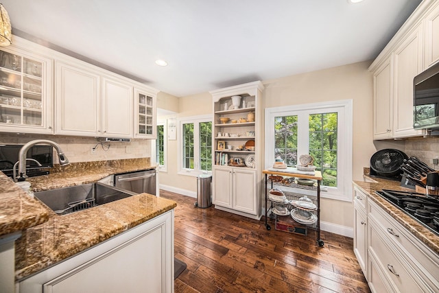 14300 Ridgemont St, Gregory, MI 48137 - kitchen featuring appliances with stainless steel finishes, recessed lighting, light stone countertops, dark wood finished floors, and tasteful backsplash