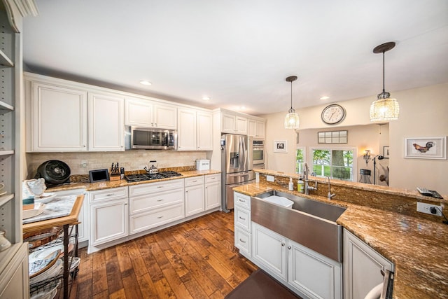 14300 Ridgemont St, Gregory, MI 48137 - kitchen with appliances with stainless steel finishes, dark wood finished floors, hanging light fixtures, white cabinetry, and recessed lighting
