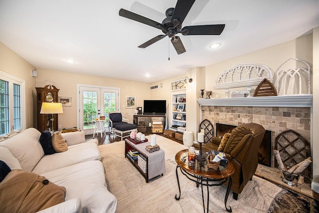 14300 Ridgemont St, Gregory, MI 48137 - living area with a ceiling fan, french doors, a fireplace, wood finished floors, and recessed lighting