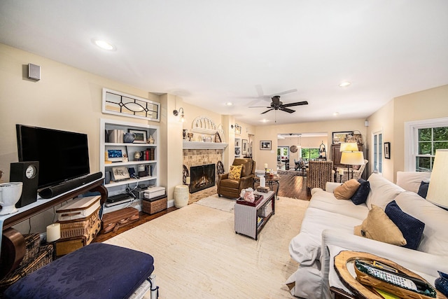 14300 Ridgemont St, Gregory, MI 48137 - living area with wood finished floors, ceiling fan, a lit fireplace, and recessed lighting