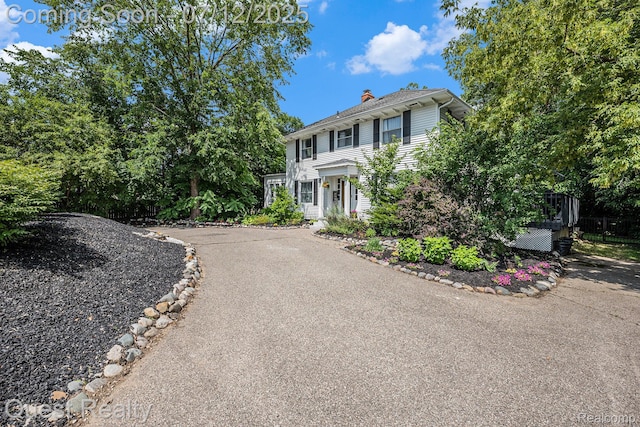 2577 John R Rd, Rochester Hills, MI 48307 - colonial house featuring a chimney and driveway