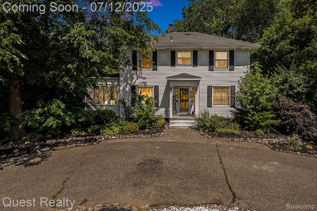 2577 John R Rd, Rochester Hills, MI 48307 - view of front of home with a chimney