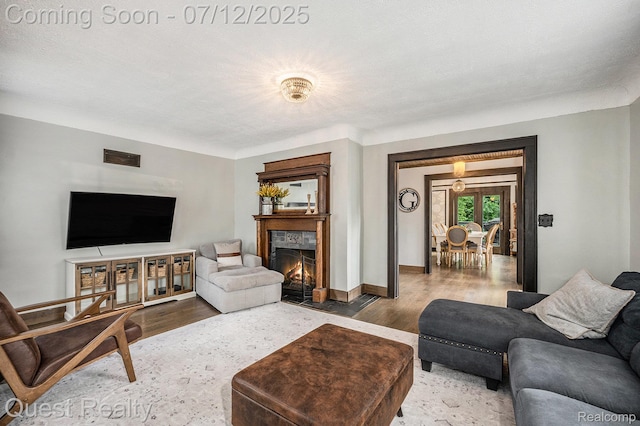 2577 John R Rd, Rochester Hills, MI 48307 - living area featuring a fireplace with flush hearth and wood finished floors