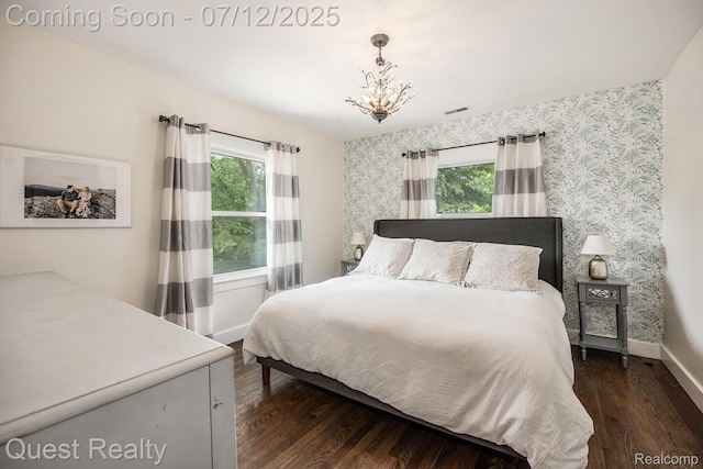 2577 John R Rd, Rochester Hills, MI 48307 - bedroom featuring multiple windows, wallpapered walls, a chandelier, and dark wood finished floors