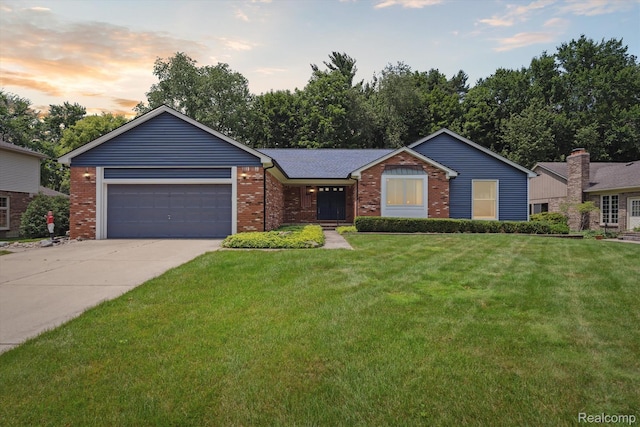 1726 Black Maple Dr, Rochester Hills, MI 48309 - ranch-style house featuring brick siding, a front yard, driveway, and a garage