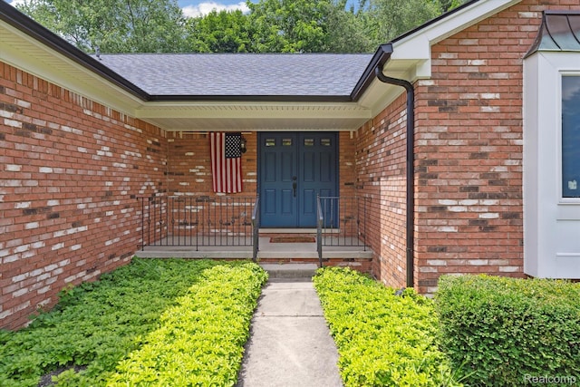 1726 Black Maple Dr, Rochester Hills, MI 48309 - property entrance featuring brick siding, roof with shingles, and a porch
