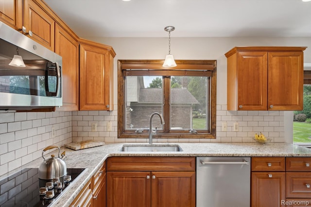 1726 Black Maple Dr, Rochester Hills, MI 48309 - kitchen featuring appliances with stainless steel finishes, brown cabinetry, and tasteful backsplash