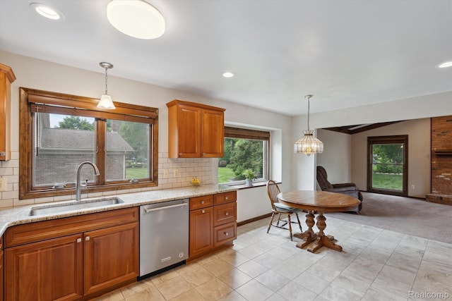 1726 Black Maple Dr, Rochester Hills, MI 48309 - kitchen with dishwasher, brown cabinetry, backsplash, light stone counters, and pendant lighting