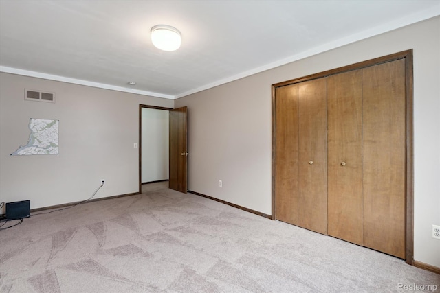 1726 Black Maple Dr, Rochester Hills, MI 48309 - unfurnished bedroom featuring light carpet, ornamental molding, and a closet