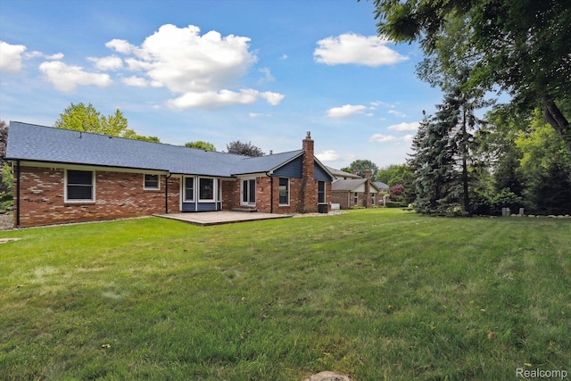 1726 Black Maple Dr, Rochester Hills, MI 48309 - rear view of property featuring a lawn, brick siding, and a chimney