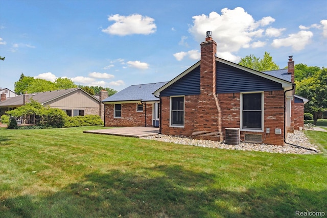 1726 Black Maple Dr, Rochester Hills, MI 48309 - back of property with a chimney, a yard, a patio area, and brick siding