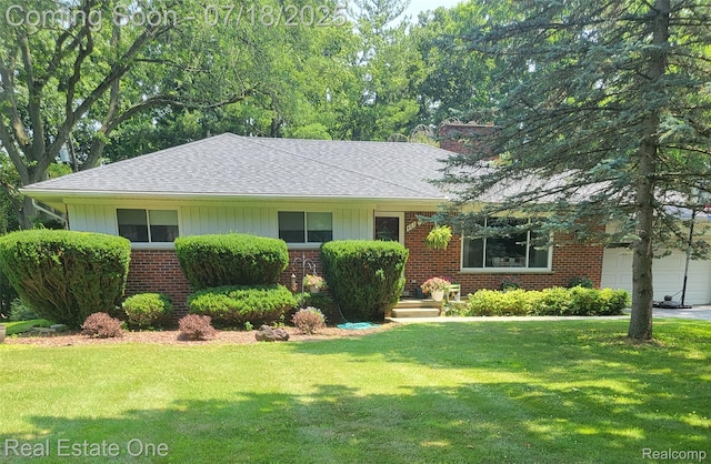 483 Rochdale Dr S, Rochester Hills, MI 48309 - ranch-style home with brick siding, a front lawn, a shingled roof, and a chimney